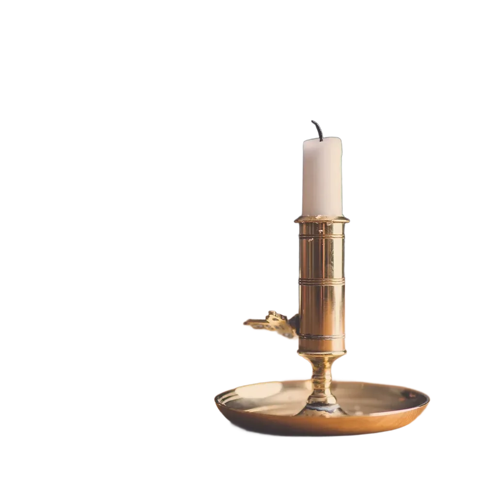 A brass candle holder with a white candle, cut out by LassoCut on a transparent background